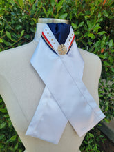 Load image into Gallery viewer, ERA SOPHIE/Siena STOCKTIE - White &amp; navy with red, gold &amp; navy "V" piping, gold tone crystals and gold brooch
